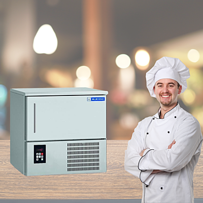 Chef placing food trays into a Blue Star BF03G Blast Freezer. Chef placing food trays into a Blue Star BF03G Blast Freezer.